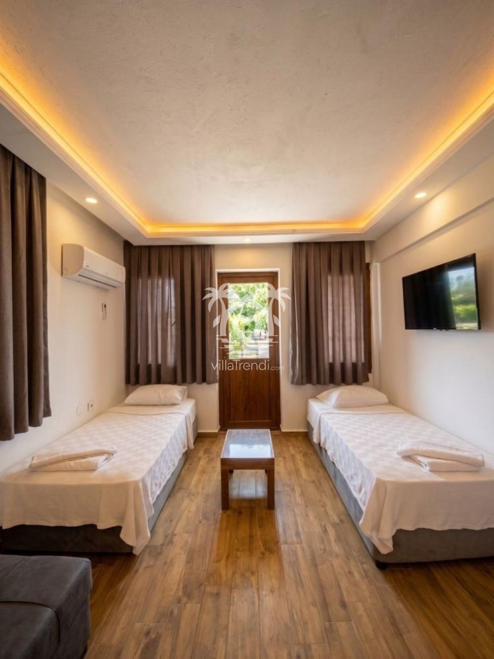 Çalış plajına yakın apart kapasiteyi 4 kişiye çıkaran iki tek kişilik yataklı salon.