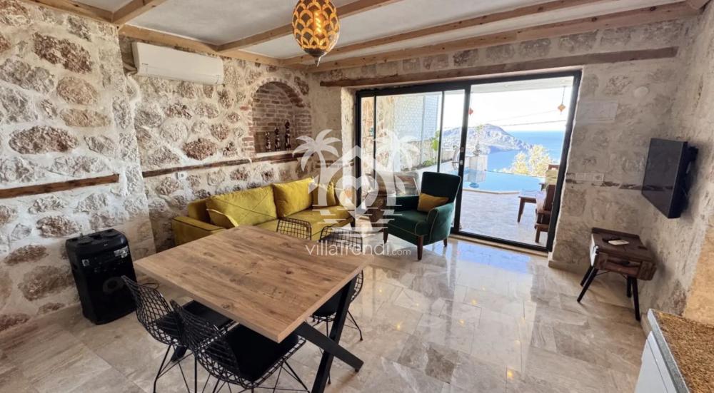 Kalkan Akbel balayı villası Kapsül deniz manzaralı salon ve oturma grubu.