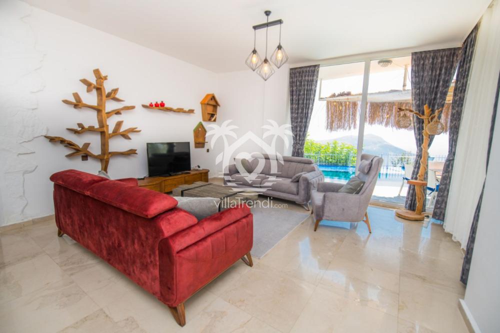 Villa Likya Akbel kırmızı konforlu salon oturma grubu ve deniz manzarası.