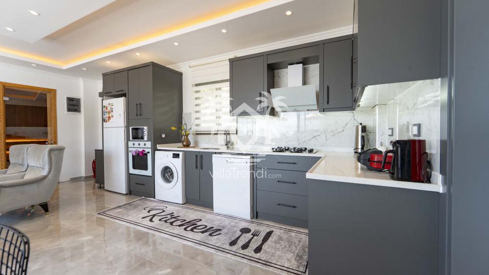 Kalkan İslamlar kiralık villa Viento tam donanımlı modern Amerikan mutfak.