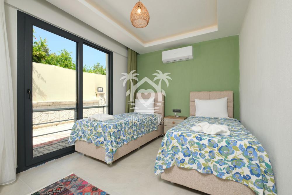 Villa Pri 1 iki tek kişilik yataklı ferah çocuk ve genç odası.
