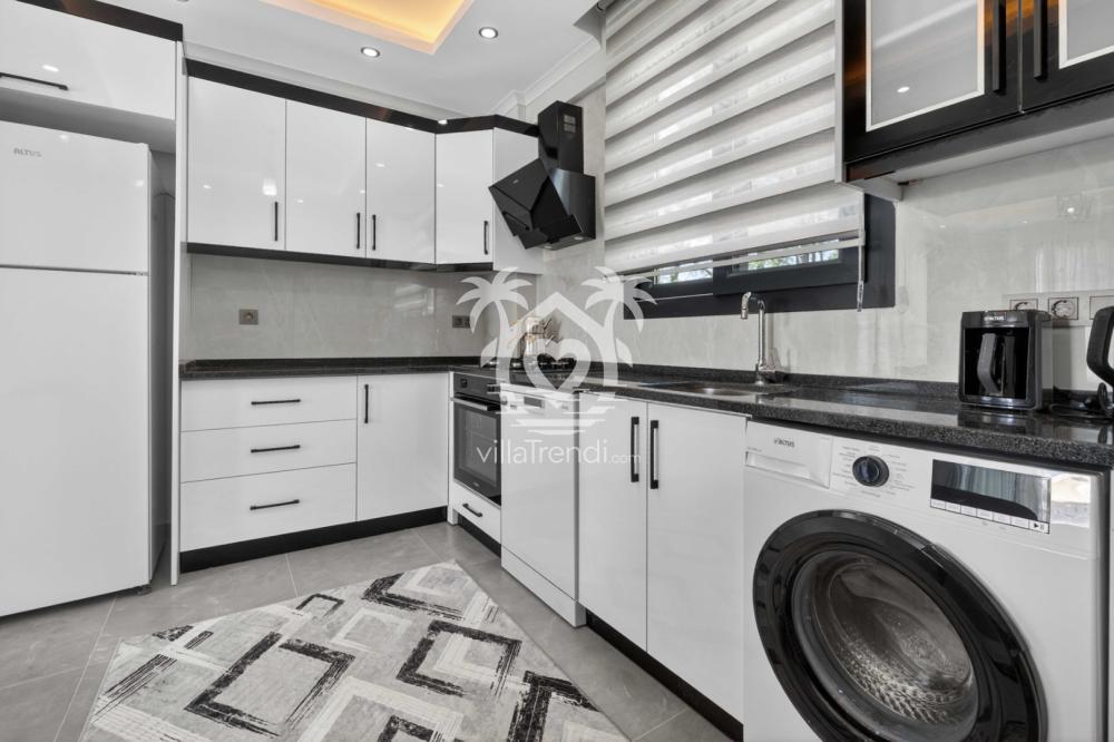 Villa Doğa Seydikemer tam donanımlı mutfak ve çamaşır makinesi detayı.