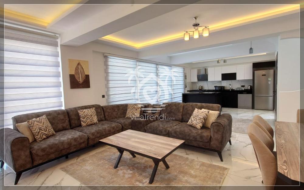 Villa Nes Duo konforlu oturma grubu ve doğa manzaralı ferah salon tasarımı.