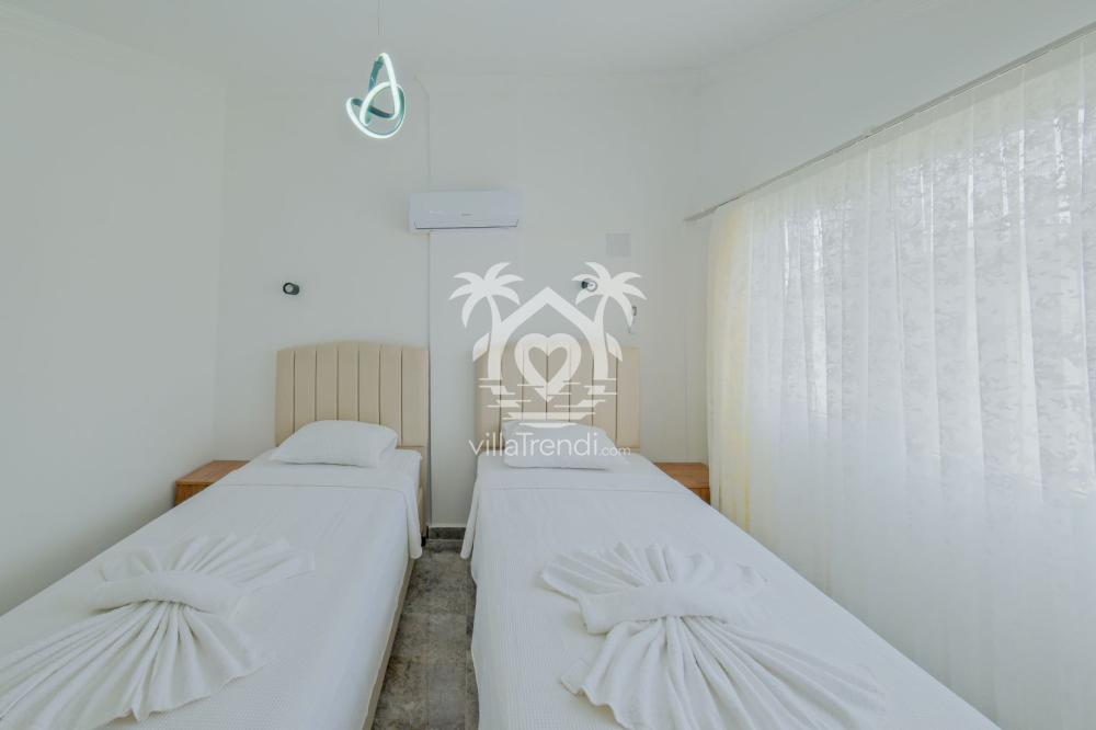 Villa Sarıman 2 Seydikemer iki tekli yataklı genç odası tasarımı